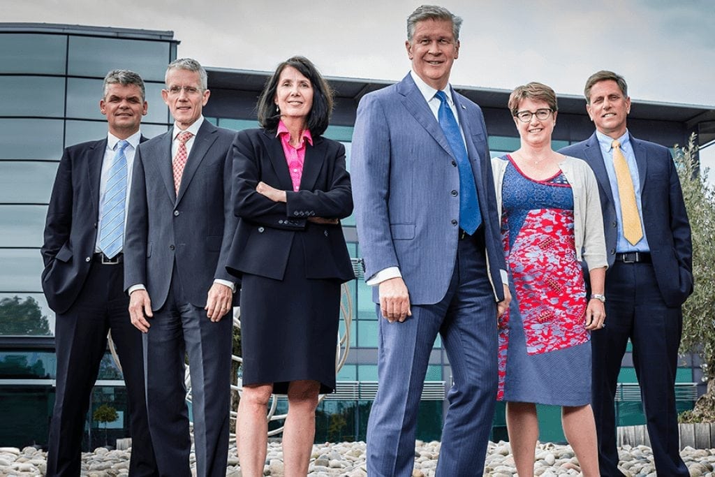 A photo of Travelport's executive team at the company's headquarters in Langley, UK. In the center is Travelport CEO Gordon Wilson.