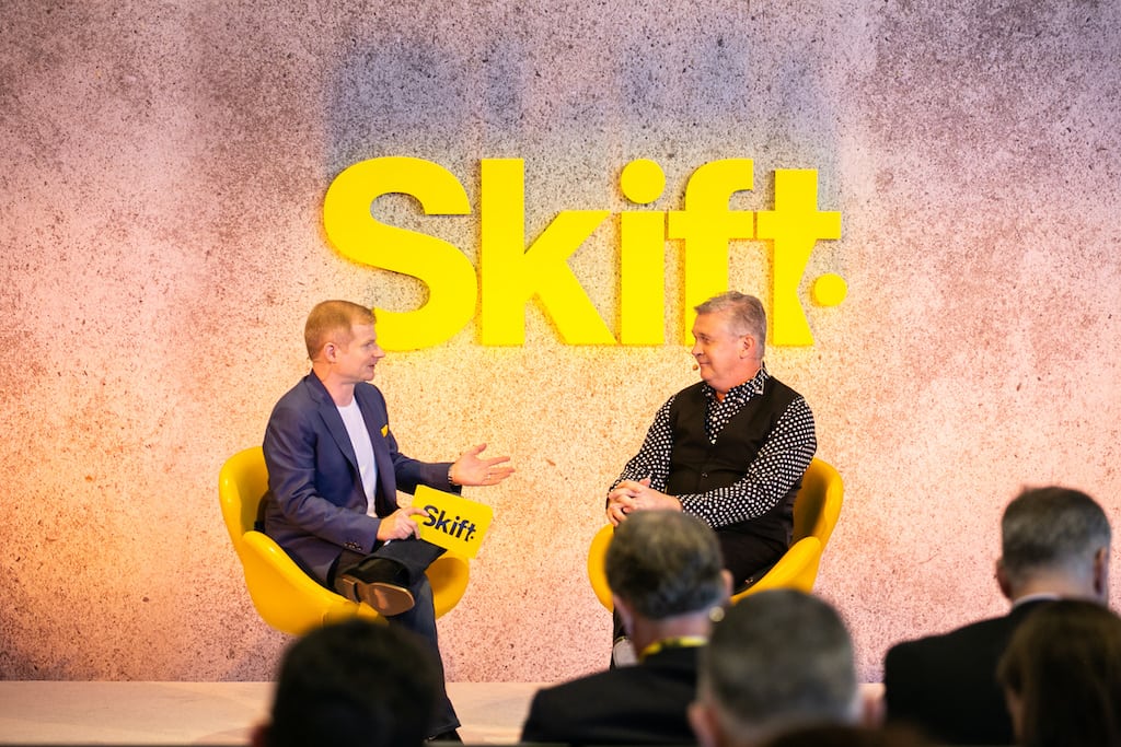 Travelport CEO Gordon Wilson, right, opines on the future of corporate travel at Skift Tech Forum on Tuesday.
