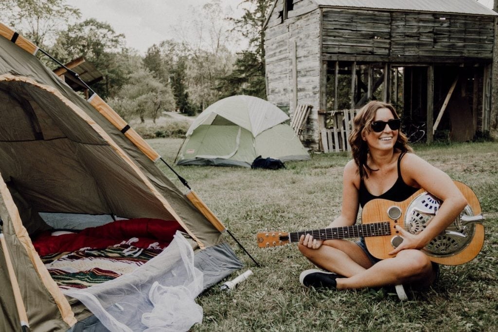 A posed photo of a happy camper. You, too, can be a happy camper, according to new startup Hipcamp offers places to pitch a tent or book a glamping trip.