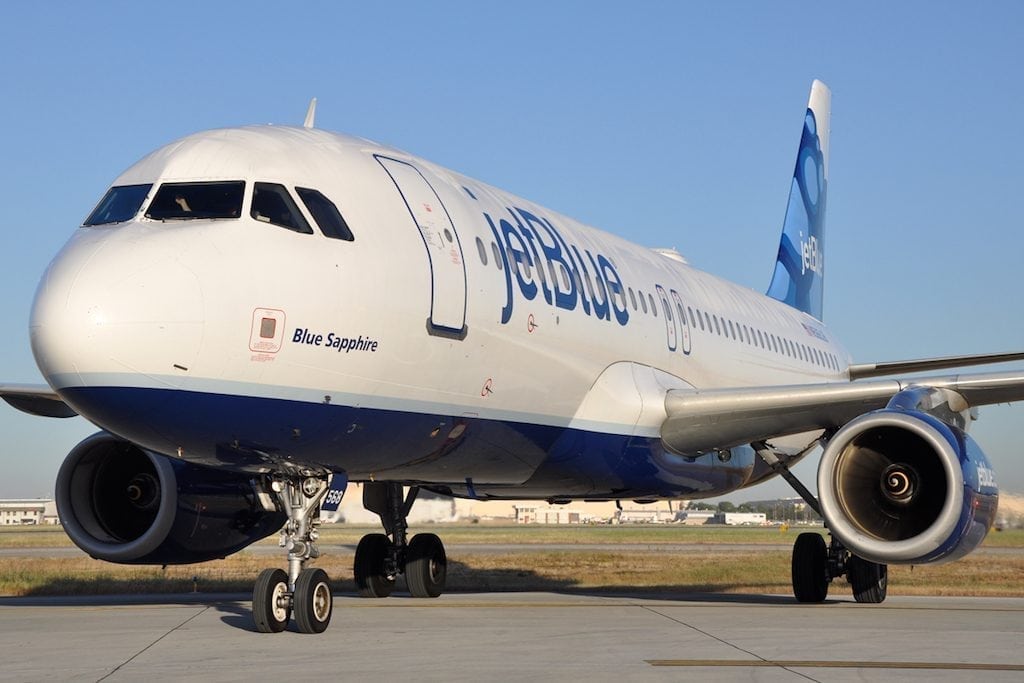 A JetBlue aircraft is shown. The airline will start offering a cheaper fare with pared-down perks.