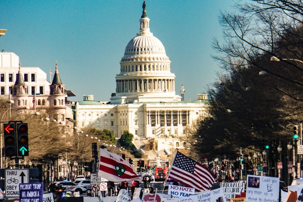 Sixty-two percent of travel buyers said in a recent survey they believed the administration's policies had led to a reduction in business travel. A February 2017 protest against the initial ban in Washington, D.C. is shown.