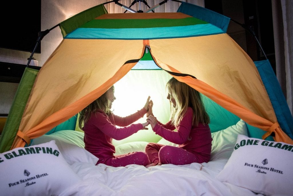 Children play in a tent at the Four Seasons Hotel Boston. 