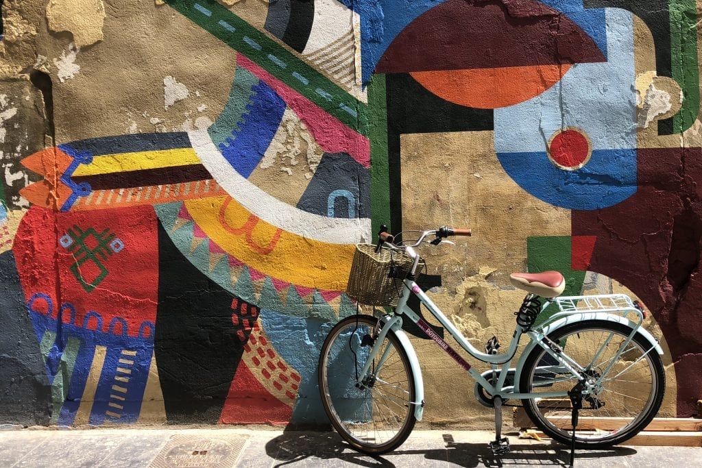The author's bicycle against a backdrop of colorful, Valencian street art.