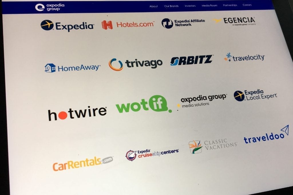 Pictured are the logos for some of the Expedia Group brands. The company hasn't made a major acquisition in several years.