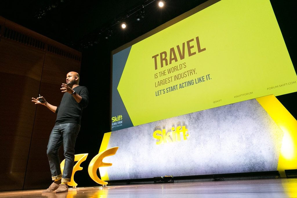 Skift Founder and CEO Rafat Ali on stage at a Skift Forum. 