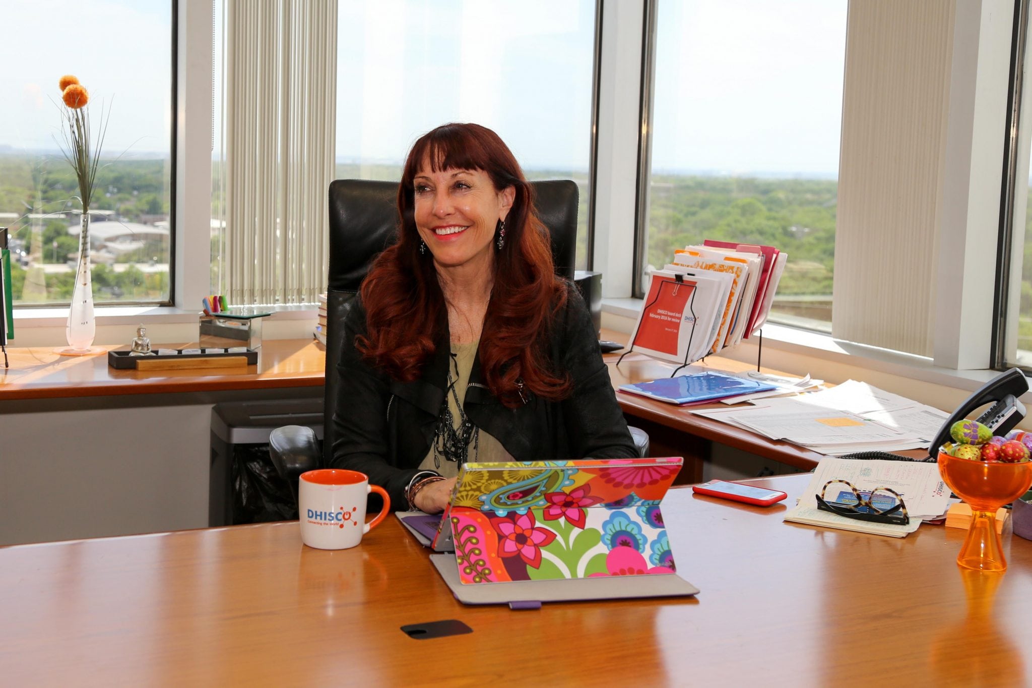 Toni Portmann, shown here at the Dallas headquarters of travel technology company DHISCO, was hired as CEO three years ago to turn around a struggling company. Today the business was acquired by RateGain.