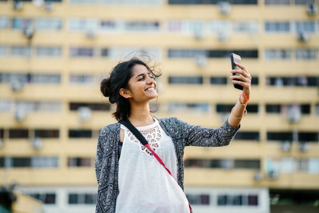Outbound travel from India is expected to boom within a matter of years, and young people are a key driving segment. Above, a young Indian woman takes a selfie. 