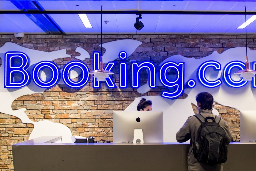 Shown here is an entrance at the headquarters of Booking.com, the largest company in the Booking Holdings portfolio. The conglomerate reported its second-quarter earnings for 2018 on Thursday and said that its direct bookings are growing.