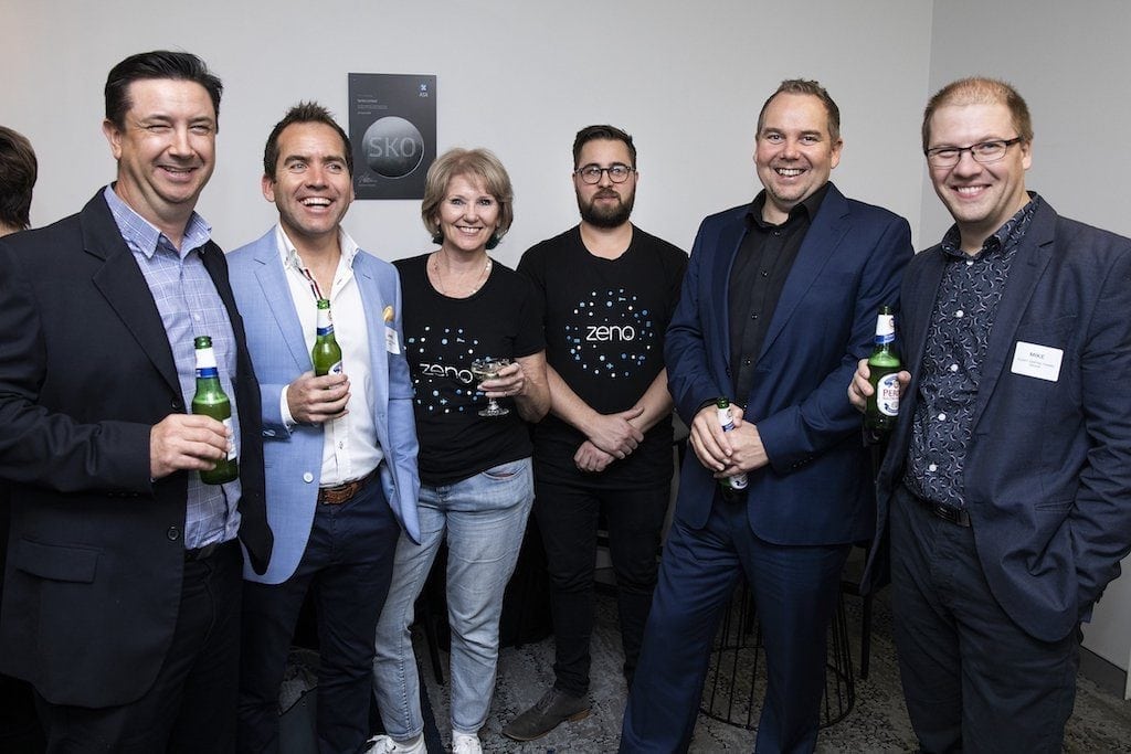 Serko CEO Darrin Grafton, second from right, at a cocktail event with a bunch of happy people.