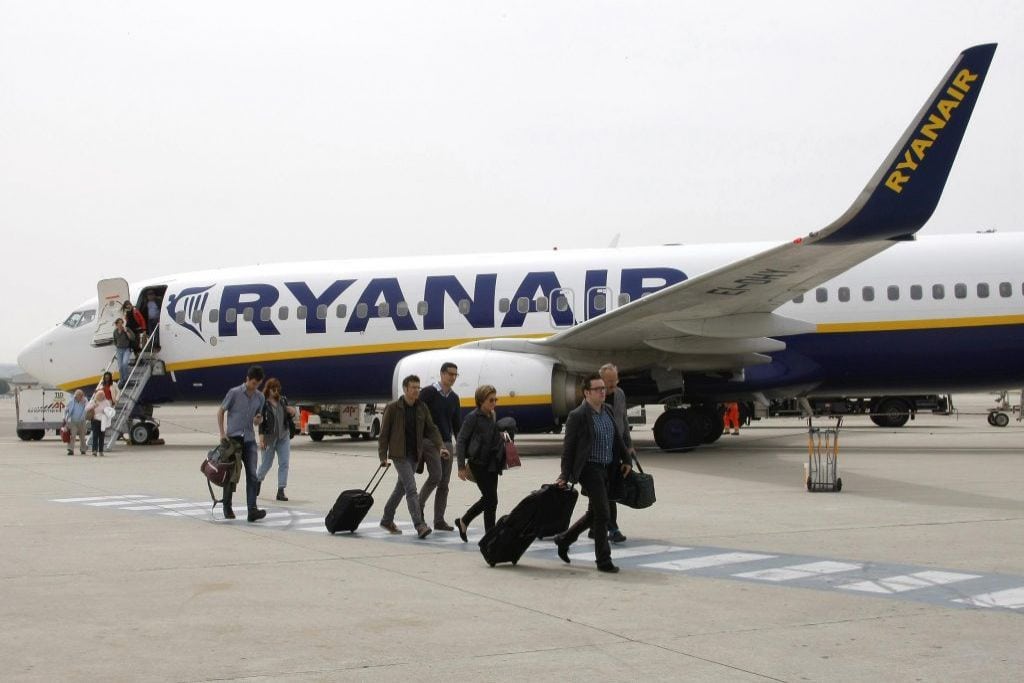 In this Wednesday, May 13, 2015 file photo, passengers disembark a Ryanair plane, at the Marseille Provence airport, in Marignane, southern France.  
