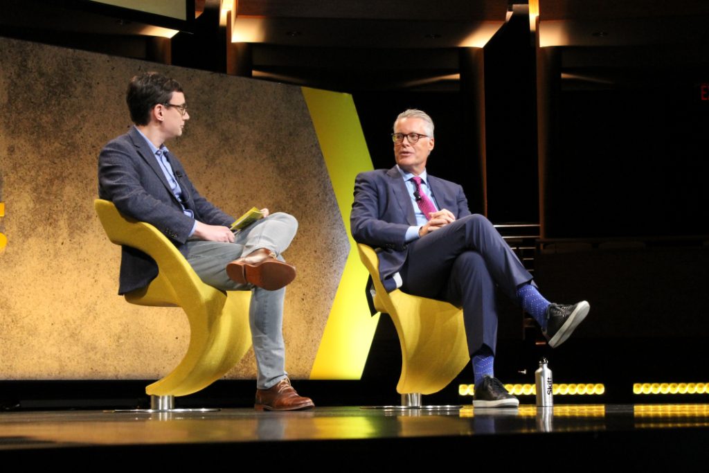 Delta CEO Ed Bastian (right) speaks on stage at Skift Global Forum in New York City on Friday, September 28, 2018.