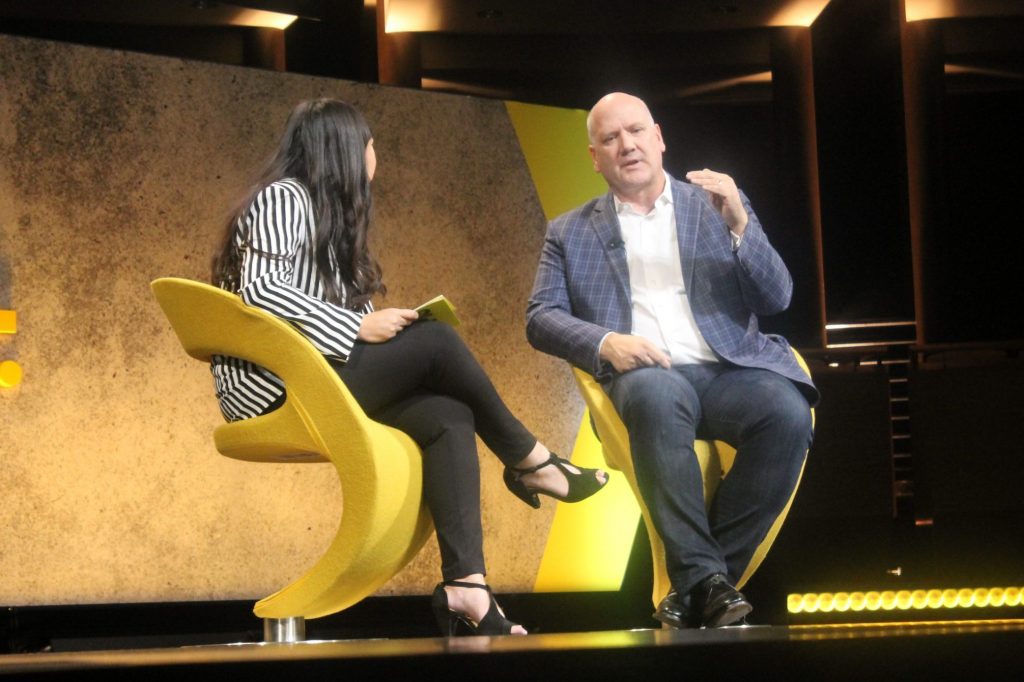 Airbnb President of Homes Greg Greeley, right, is interviewed by Senior Hospitality Editor Deanna Ting at Skift Global Forum Thursday.