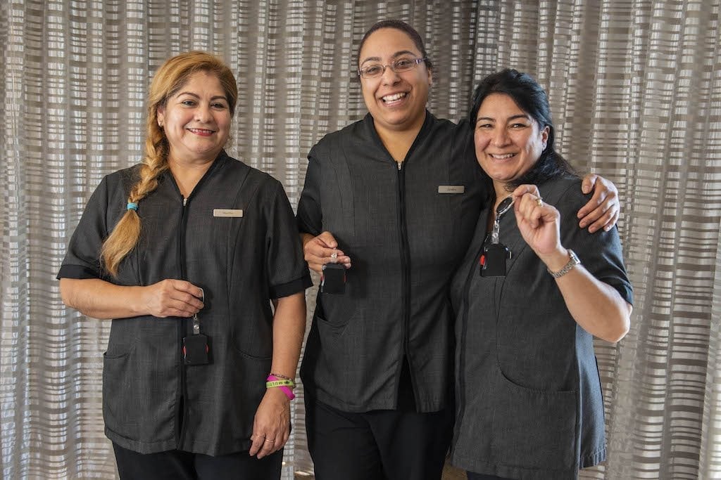 Marriott housekeepers with employee safety devices, or panic buttons. Marriott, along with Hilton, Hyatt, IHG, and Wyndham, is committing to giving panic buttons to its U.S.-based hotel workers by 2020.