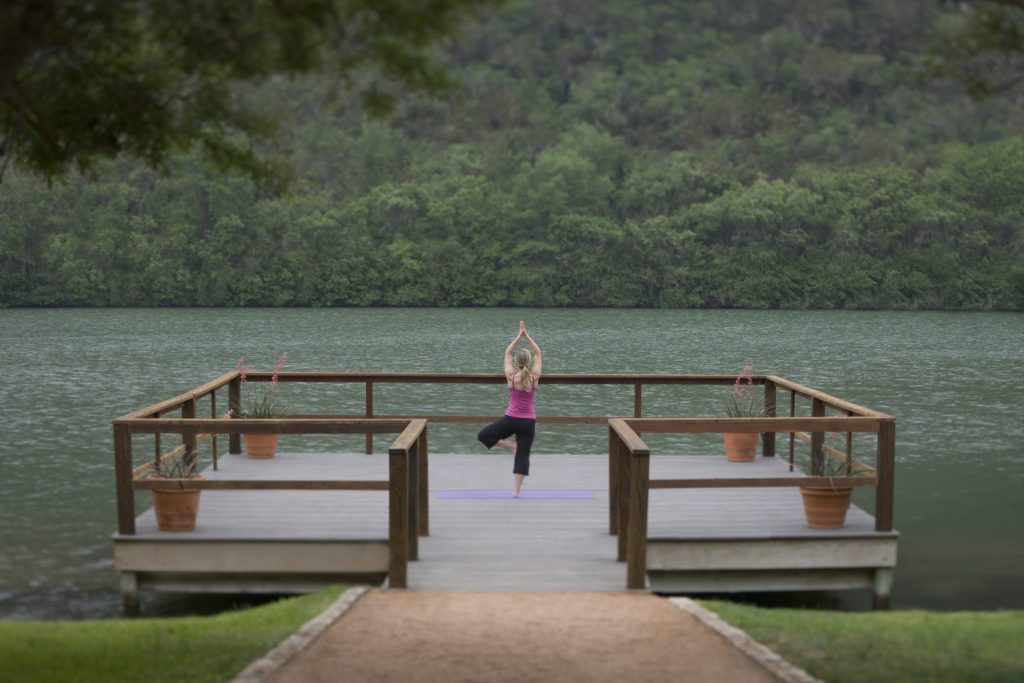 Yoga on Lake Austin. Wellness tourism is big business in the Texas capital.