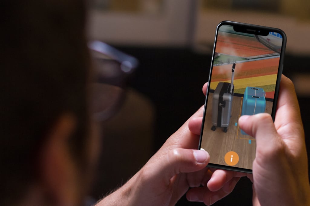 Shown here on an iPhone X is how KLM Royal Dutch Airlines is using Augmented Reality (AR) to make it easy for passengers with a smartphone camera to see whether their hand baggage is of the correct size. 