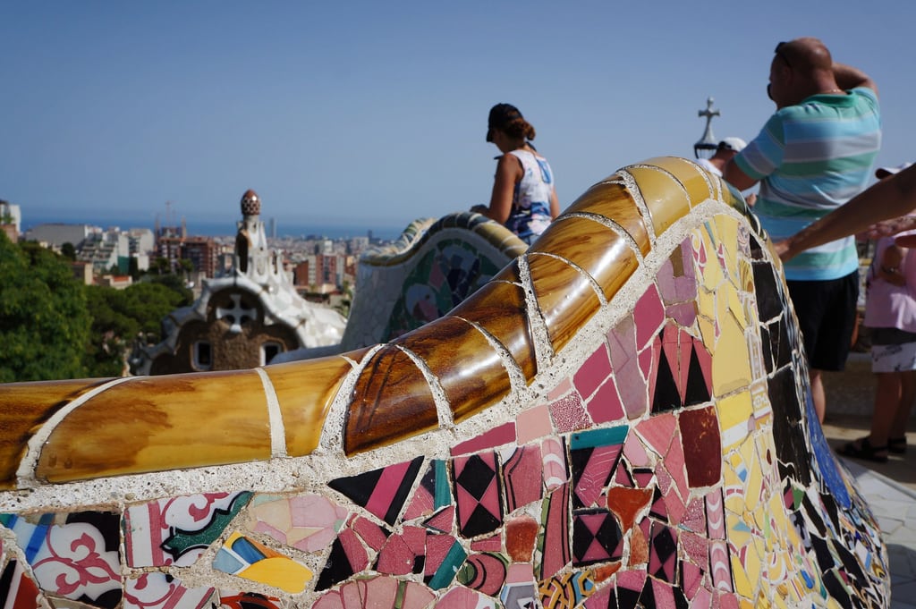 Residents in eight European cities, including Barcelona, were surveyed in a new UNWTO report. Pictured are tourists at Parc Guell in Barcelona.