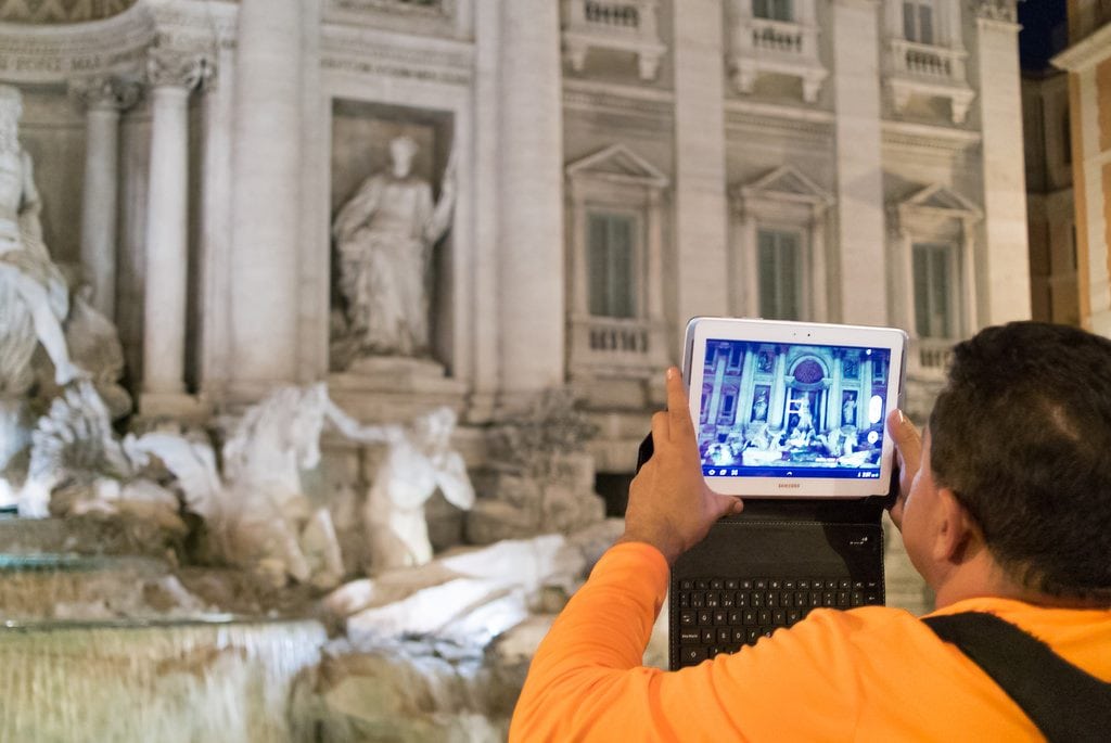 Musement was acquired by TUI Group for an undisclosed amount. Pictured is a tourist at the Trevi Fountain in Rome.