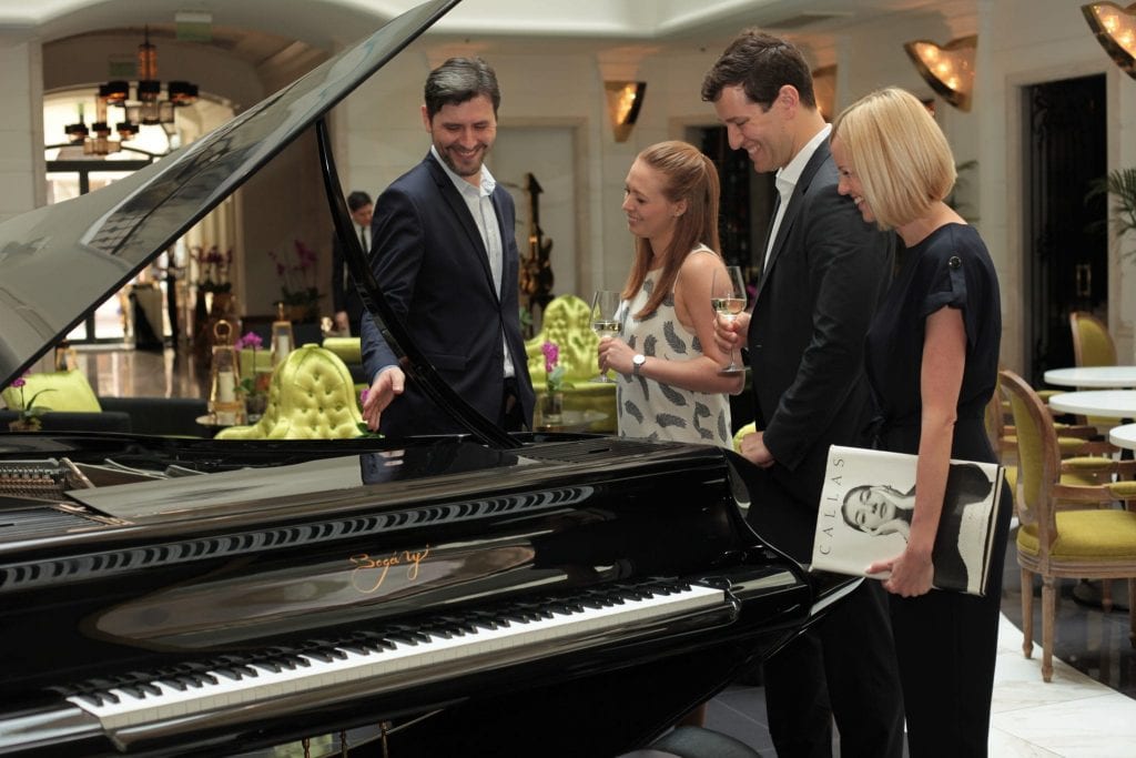 Kornél Magyar (left) sharing some of his musical insights with guests at the Aria Hotel in Budapest.