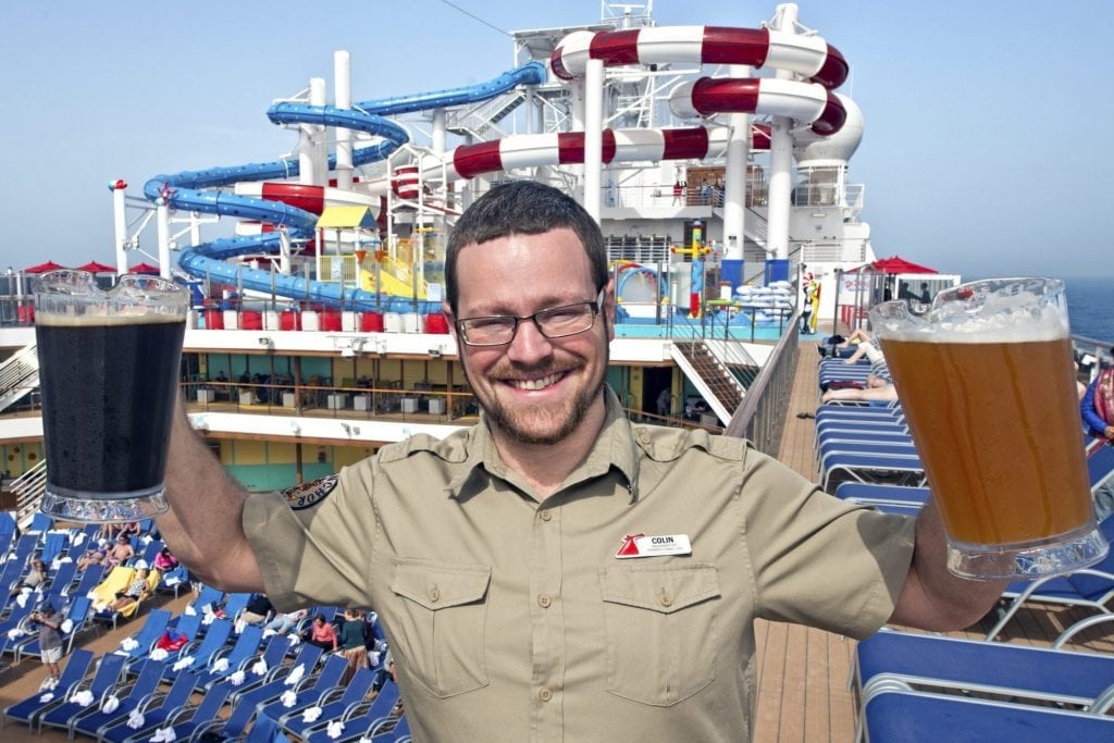 Colin Presby, brewmaster for Carnival Cruise Line, holds up pitchers of his creations aboard Carnival Horizon. 