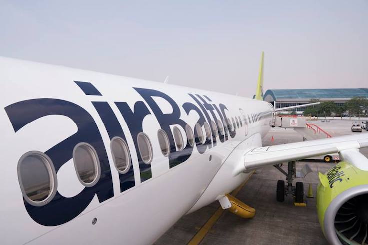 An AirBaltic aircraft on the apron at the airport.