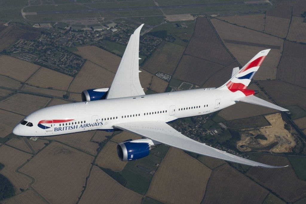 A British Airways 787 Dreamliner flies over Rolls Royce sites in Derby, UK. British Airways is adding routes to South Africa.