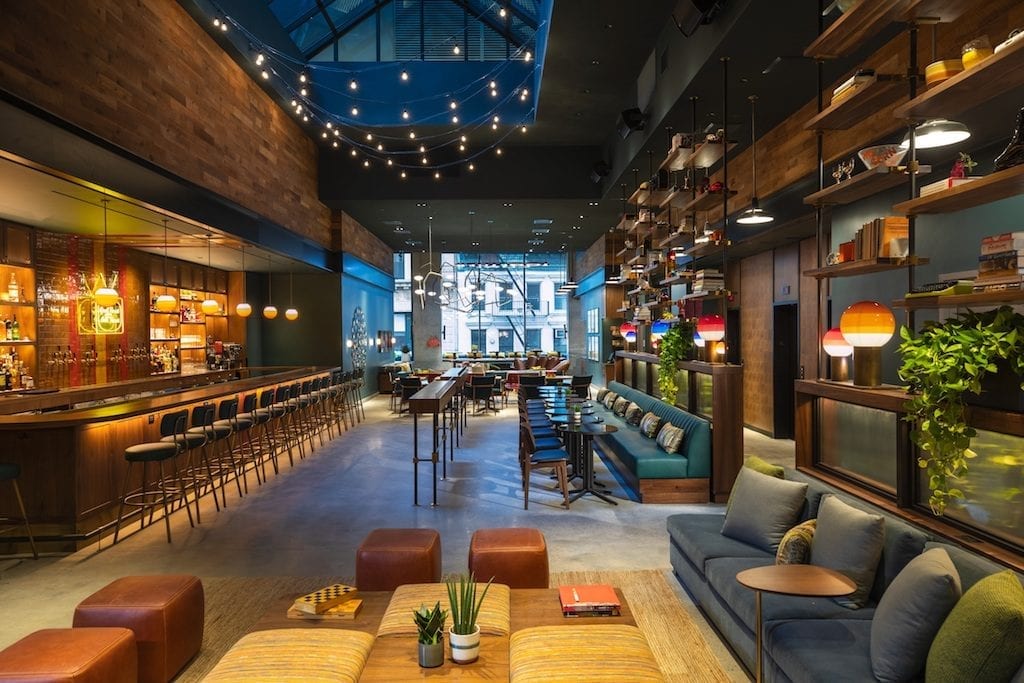 Marriott's Moxy hotels brand has partnered with mobile networking and dating app Bumble to encourage Bumble users to meet at its hotels. Pictured here is the lobby of the Moxy New York City Downtown where one of the BumbleSpots is located.