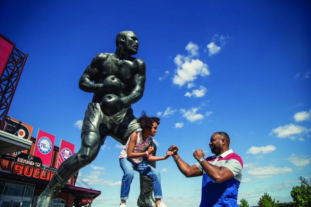 The 12-foot bronze statue of Philadelphia boxing legend Joe Frazier sits directly outside of the Xfinity Live! complex. Visit Philadelphia is still seeing success from its year-old black-centric video series. 