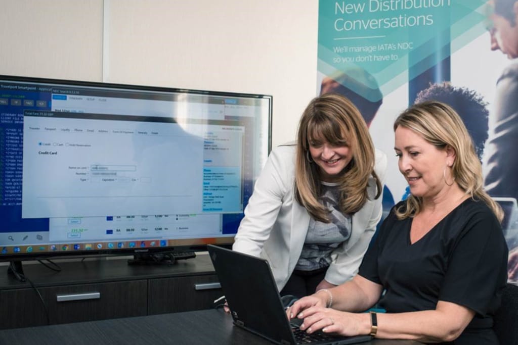 Travelport’s Claire Osborne (left) with Meon Valley Travel’s Kelly Doherty making the first New Distribution Capability booking at the agency’s offices in Leicester, UK, in October 2018.  Training is key for new travel agents, as well as veterans.