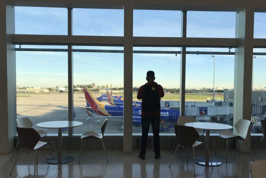 A traveler looks out over Southwest planes at Fort Lauderdale-Hollywood International Airport last year. Southwest is trying to broaden its credit card base.