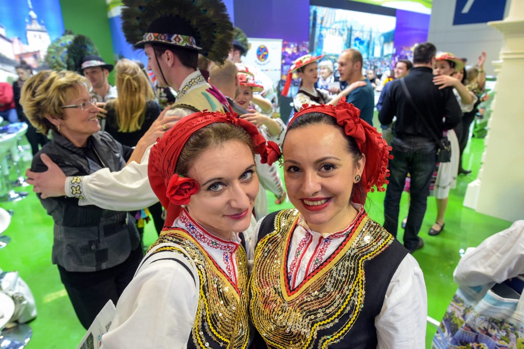 Representatives from Romania encourage visitors to learn a local dance at a stand at the ITB Berlin 2018 event. Romania was one of the countries that benefited from tourism growth this year according to a new survey.