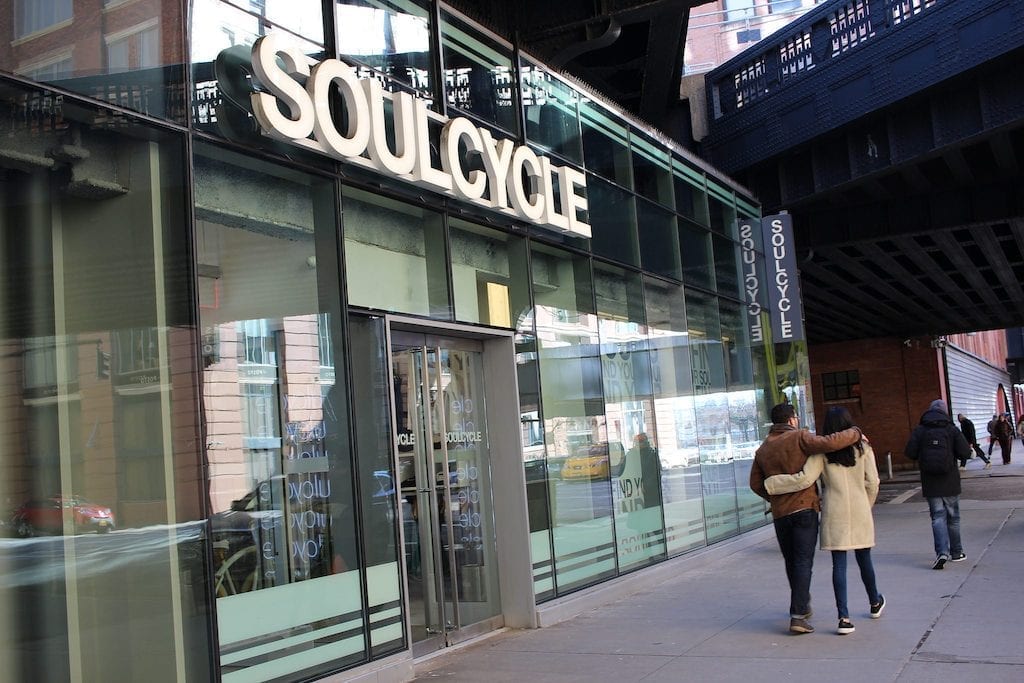 A SoulCycle storefront is shown. A new report found that the boutique spinning company has been surpassed by competitor Peloton in U.S. customer numbers.