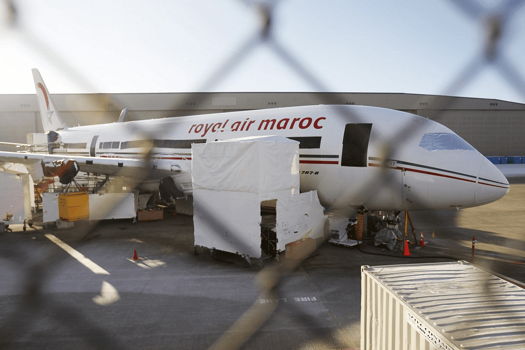 A 787 Dreamliner jet painted in Royal Air Maroc livery, sits idle on the tarmac parking at Paine Field in Everett