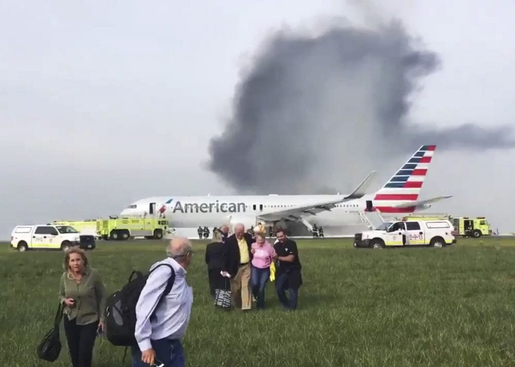 Passengers evacuate an American Airlines Boeing 767 at Chicago O'Hare in October 2016. Many journalists learned about the incident from an alert from Dataminr.