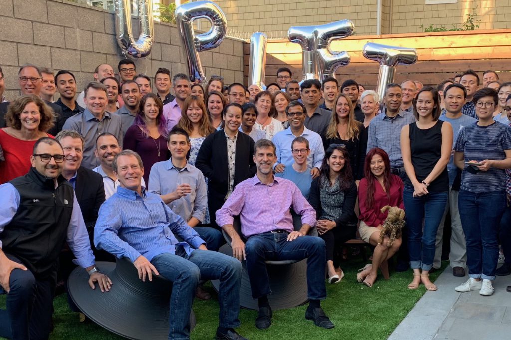 Some of the workers at Uplift, a travel financial technology startup, that has raised a $123 million Series C round. In the left corner, seated in a blue shirt, is Brian Barth, chairman and CEO of Uplift. Seated next to him is Rob Soderbery, president of Uplift.