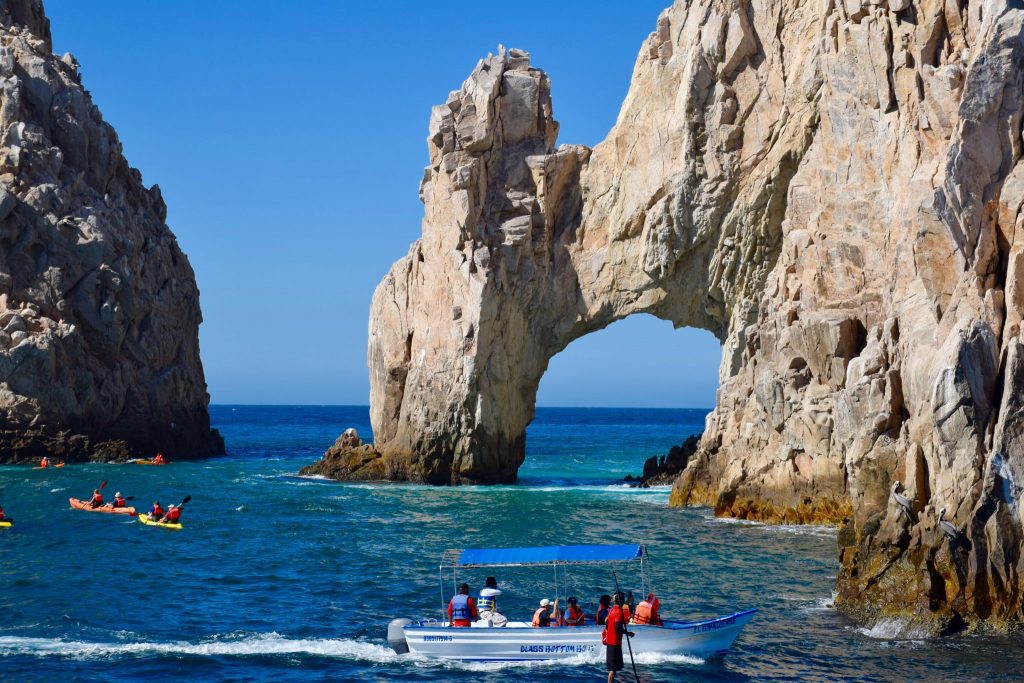 Visitors are shown in Cabo San Lucas, Mexico. The Mexico Tourism Board is closing most of its international offices and moving money from international marketing to an infrastructure project that is expected to cater to tourists.