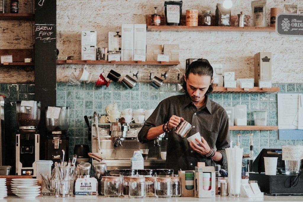 A man is shown working at a cafe. A few states have made recent moves to ban the sale of CBD-infused food and beverages.