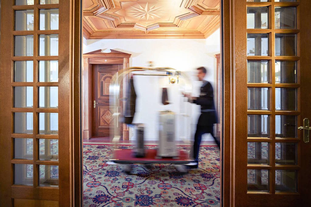 Bellboy at Kulm Hotel St. Moritz, a luxury Hotel in St. Moritz, Switzerland. 