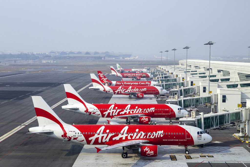 AirAsia aircraft stand next to boarding gates at Kuala Lumpur International Airport 2 in Sepang, Malaysia. The top Asian budget carrier said Monday it has launched a venture capital fund in partnership with 500 Startups, a San Francisco-based accelerator and investor.