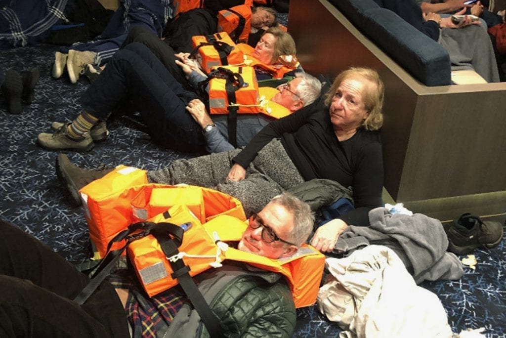 Passengers are shown on Viking Sky as an evacuation operation takes place in this photo provided by a passenger.