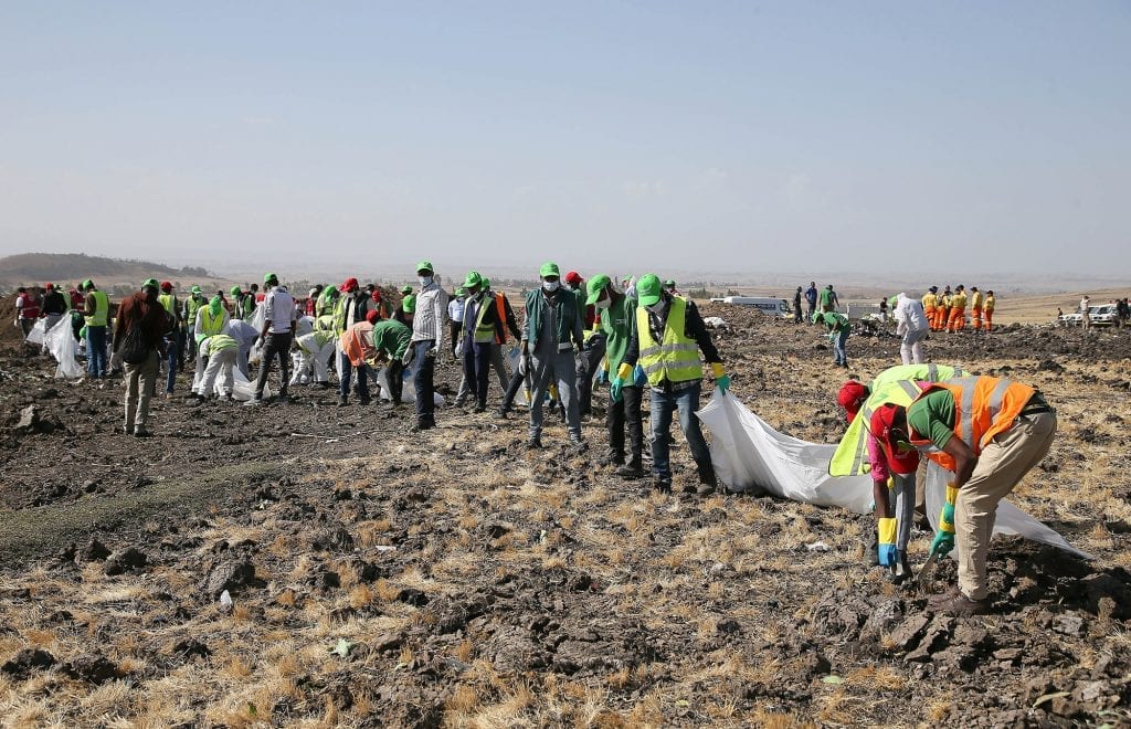 Rescue workers at the scene of the crash of Ethiopian Airways Flight 302. 