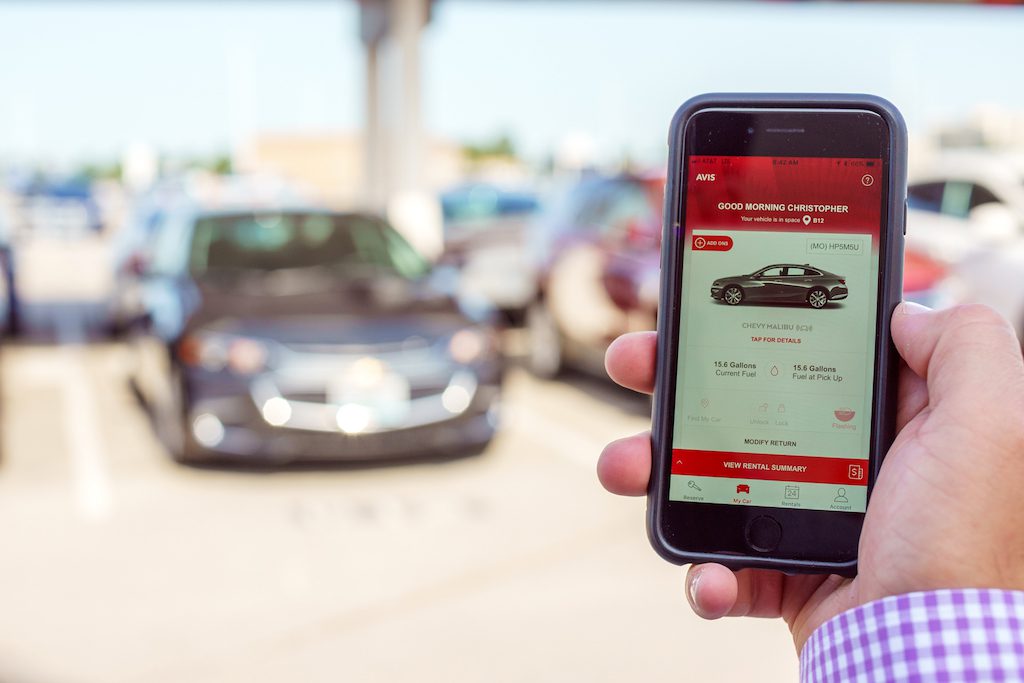 A promotional image of the Avis app from Avis Budget Group.