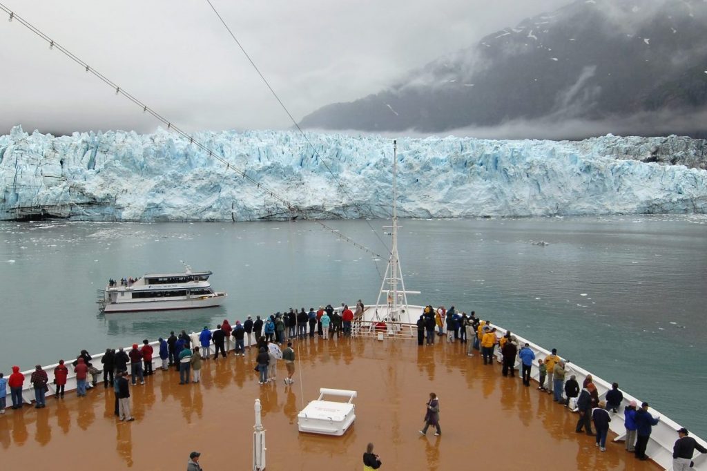 Passengers aboard Holland America Line's MS Zaandam on July 29, 2007 in Glacier Bay National Park, Alaska. The travel industry is confronting the growing issues of climate change and overtourism. 