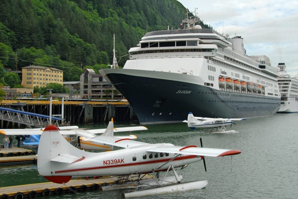 A sightseeing seaplane cruises past Holland America Line's ms Zaandam while at dock in Juneau, Alaska, in summer 2008. The Zaandam ship has been stranded for days with reportedly 140 cases of respiratory illness on board.