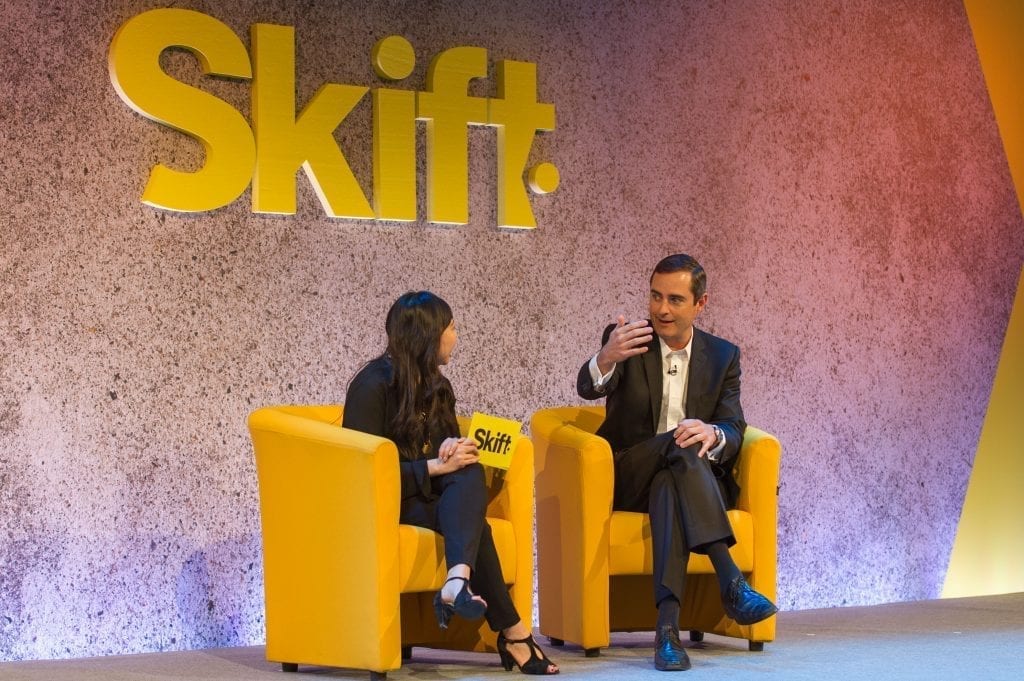 Skift Senior Hospitality Editor Deanna Ting, left, speaks to IHG CEO Keith Barr at Skift Forum Europe in London.