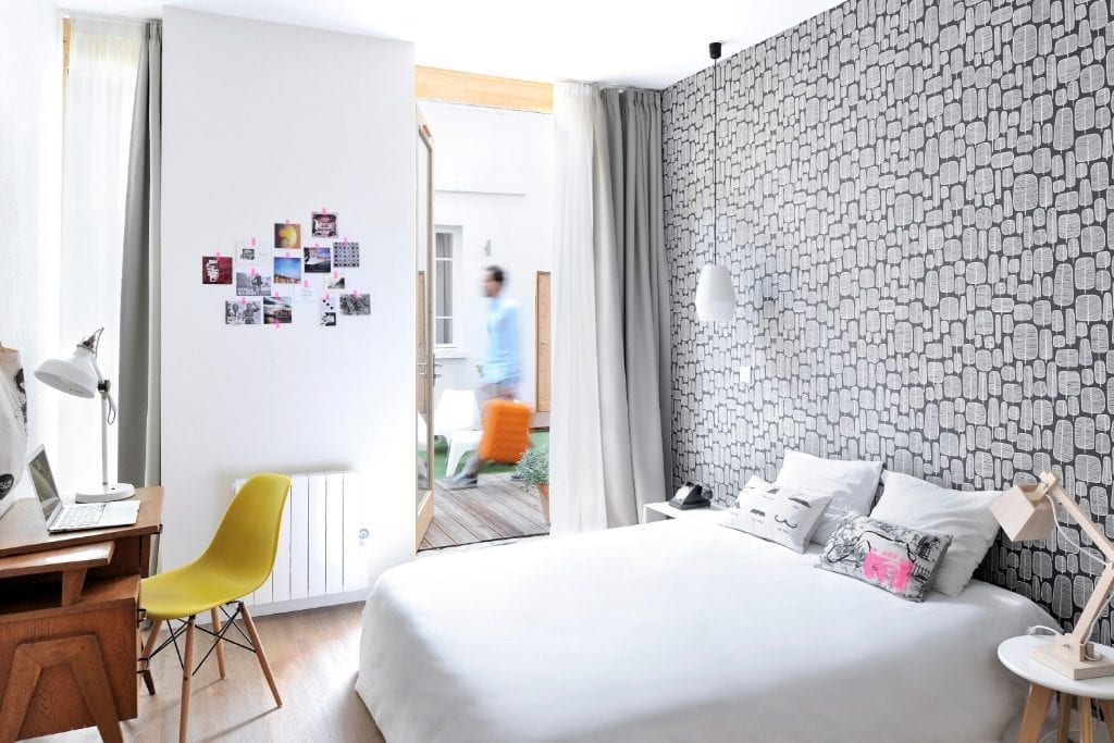 A guest room at the Slo Living hostel in Lyon, France, which uses Cloudbeds services to manage its property.