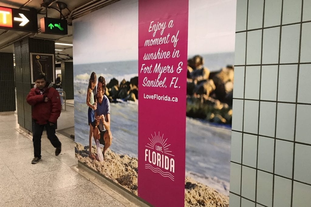 An ad promoting destinations in Florida is shown in Toronto's St. Andrew's Station in January.