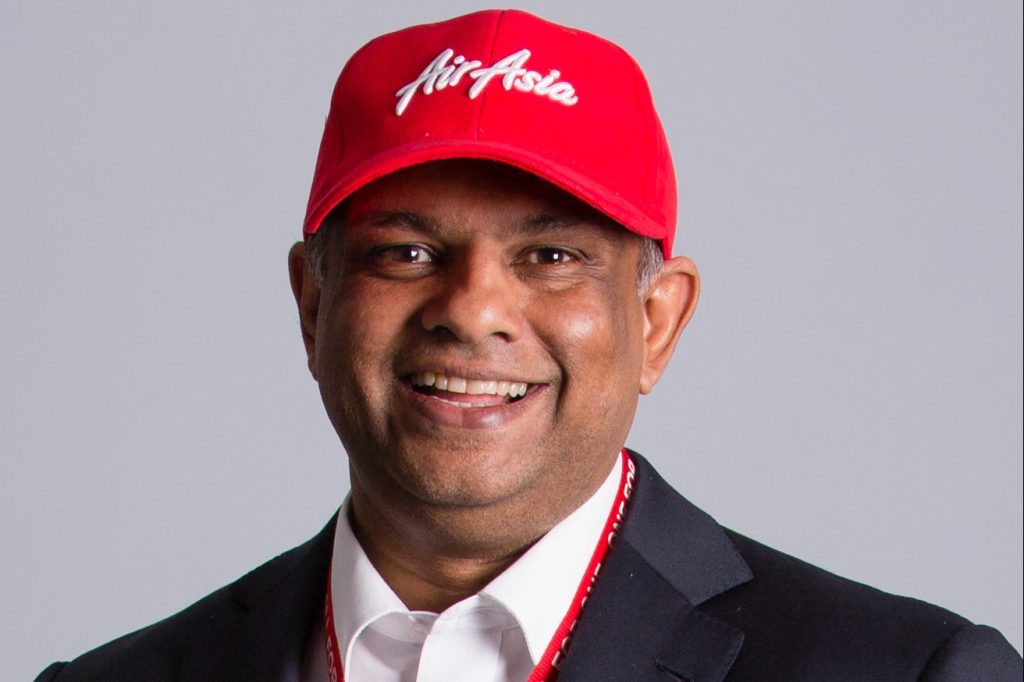 Tony Fernandes wearing an AirAsia-branded cap.