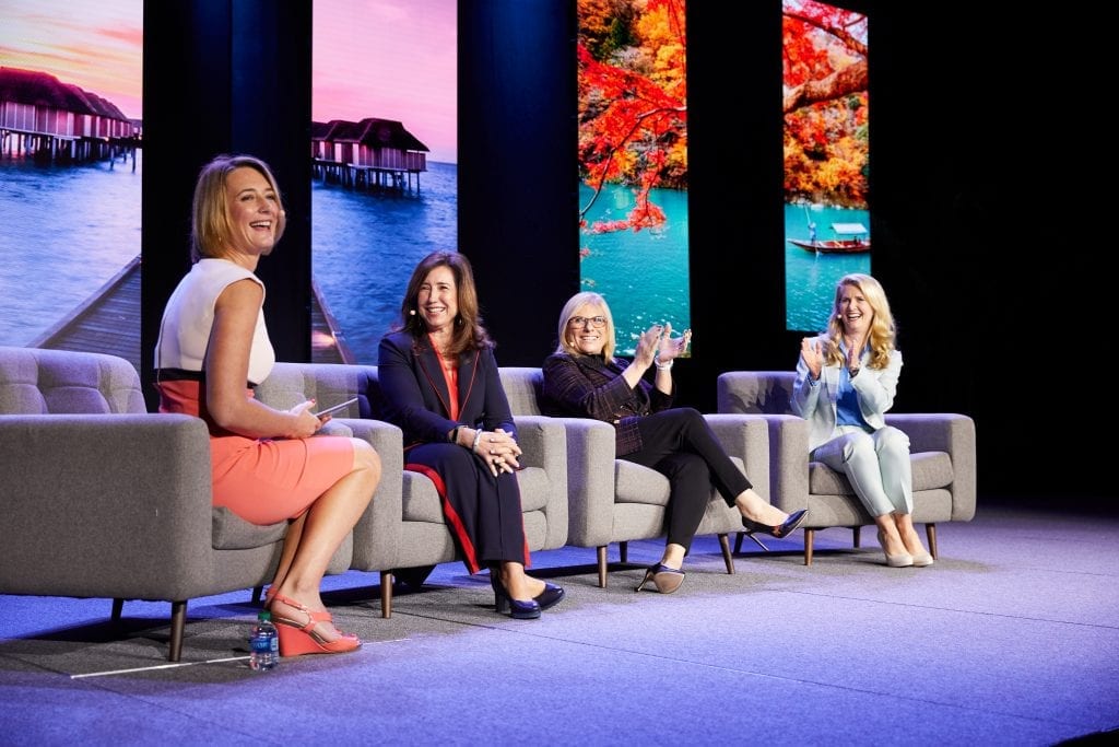 A group of cruise executives are shown at Seatrade Cruise Global. From left: BBC World News presenter Lucy Hockings, Carnival Cruise Line President Christine Duffy, Celebrity Cruises CEO Lisa Lutoff-Perlo, and Princess Cruises President Jan Swartz.