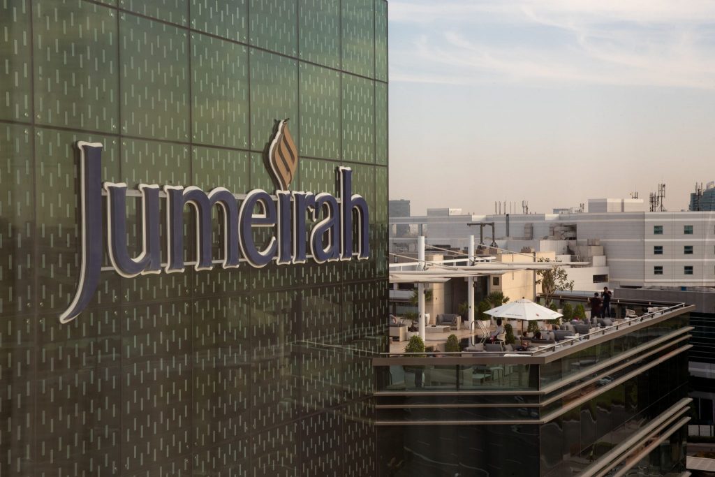 The Jumeirah Creekside Hotel in Dubai. The logo uses blue and gold.