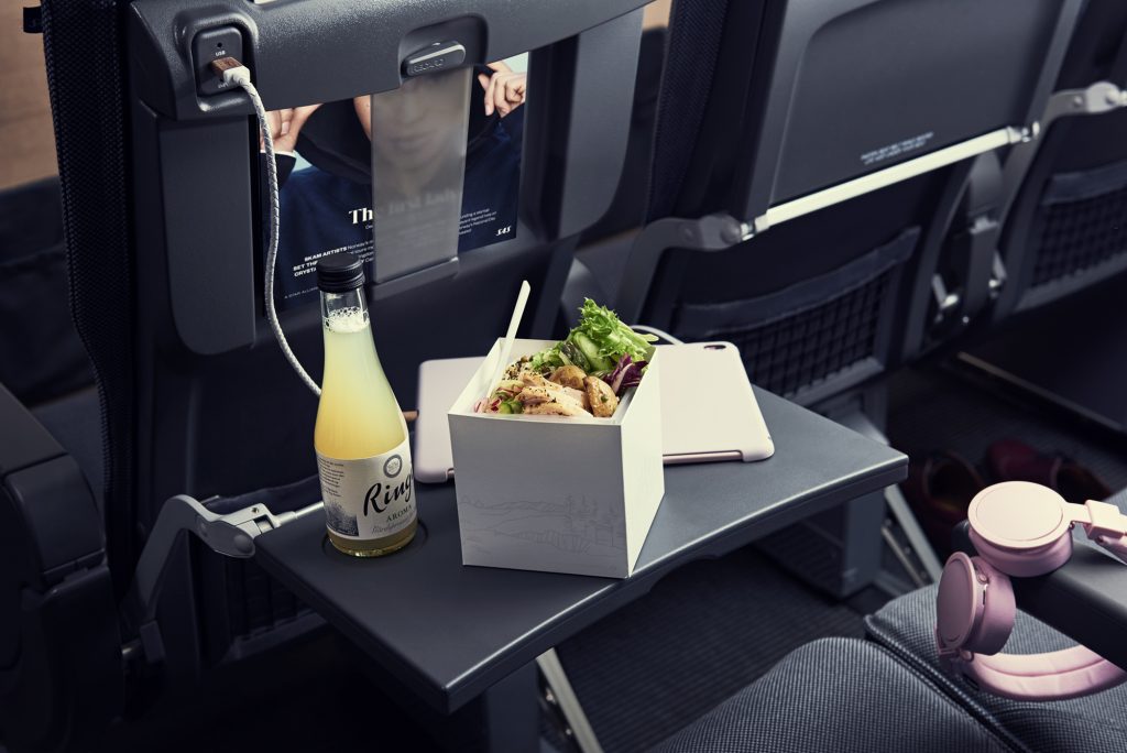 Scandinavian Airlines serves meals in compostable cardboard material. 